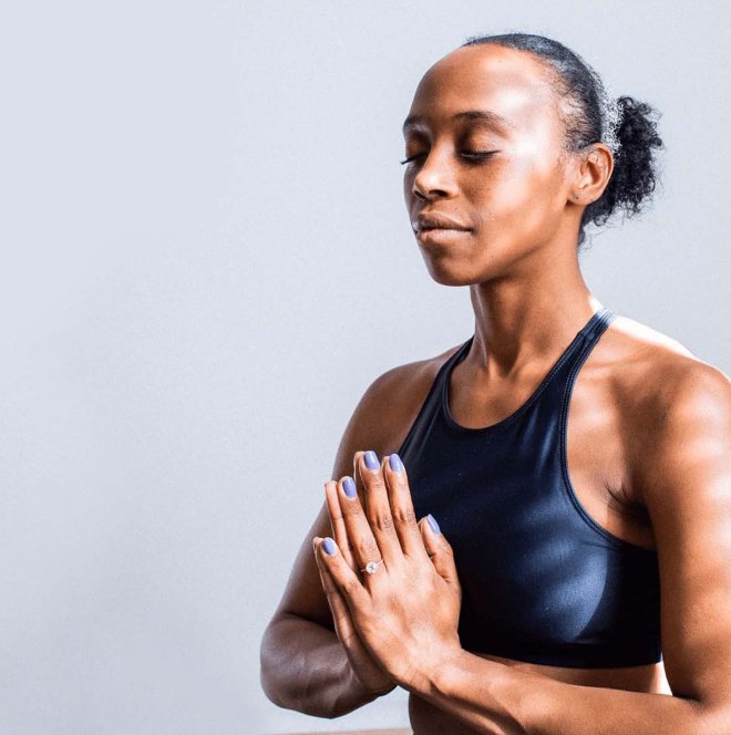 Meditating woman with a dark blue sleeveless shirt - antidepressants for menopause